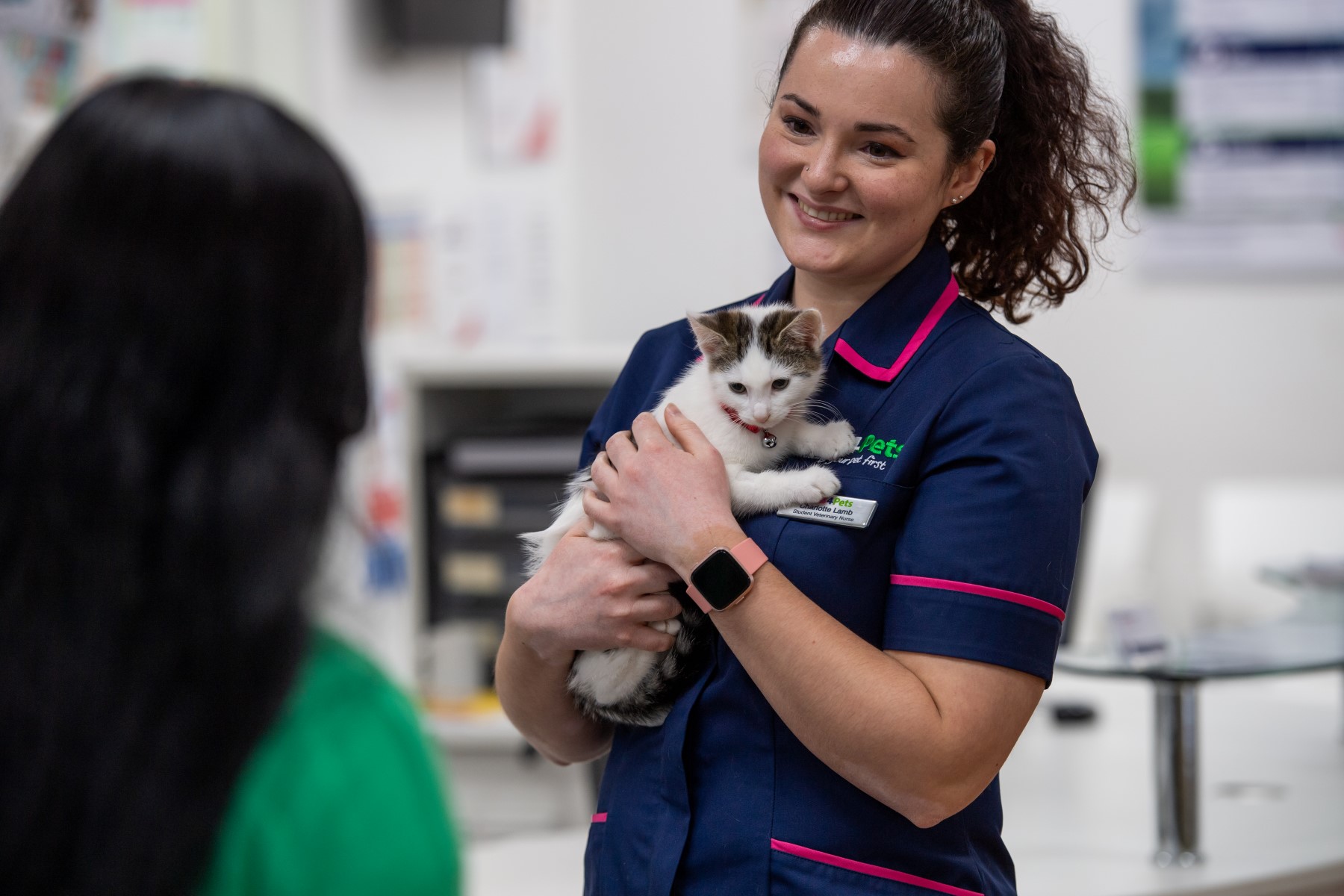 Nurse and kitten in practice